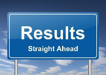 Image of a sign stating "Results Straight Ahead".